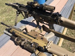SCAR rifles heavily kitted with optic and rail upgrades