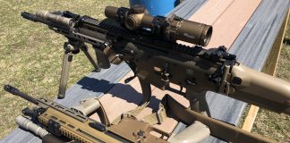 SCAR rifles heavily kitted with optic and rail upgrades